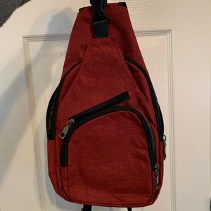 Anti-theft Red canvas day pack with charging port and cord